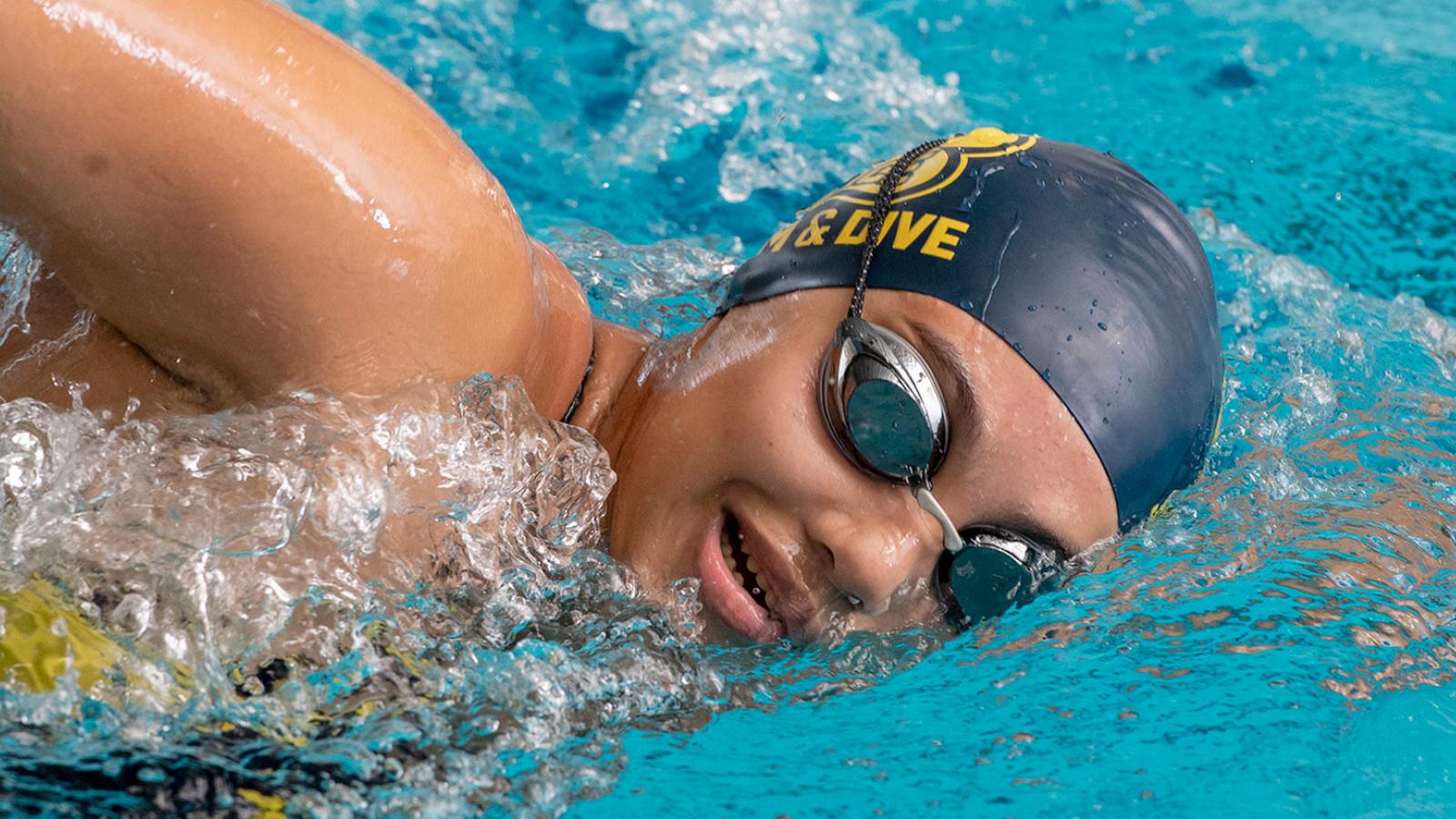 Student swimming in the pool.