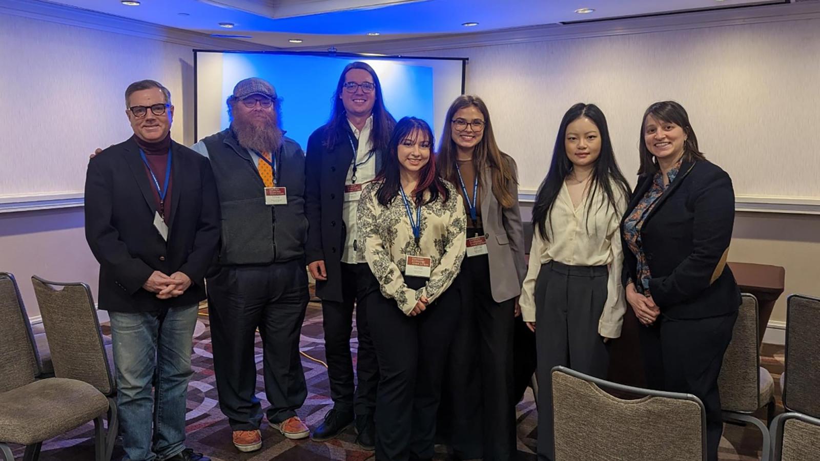 Dyson Professor Mary Kaltenerg, Hanyu Li, and other Economics faculty and students at a conference