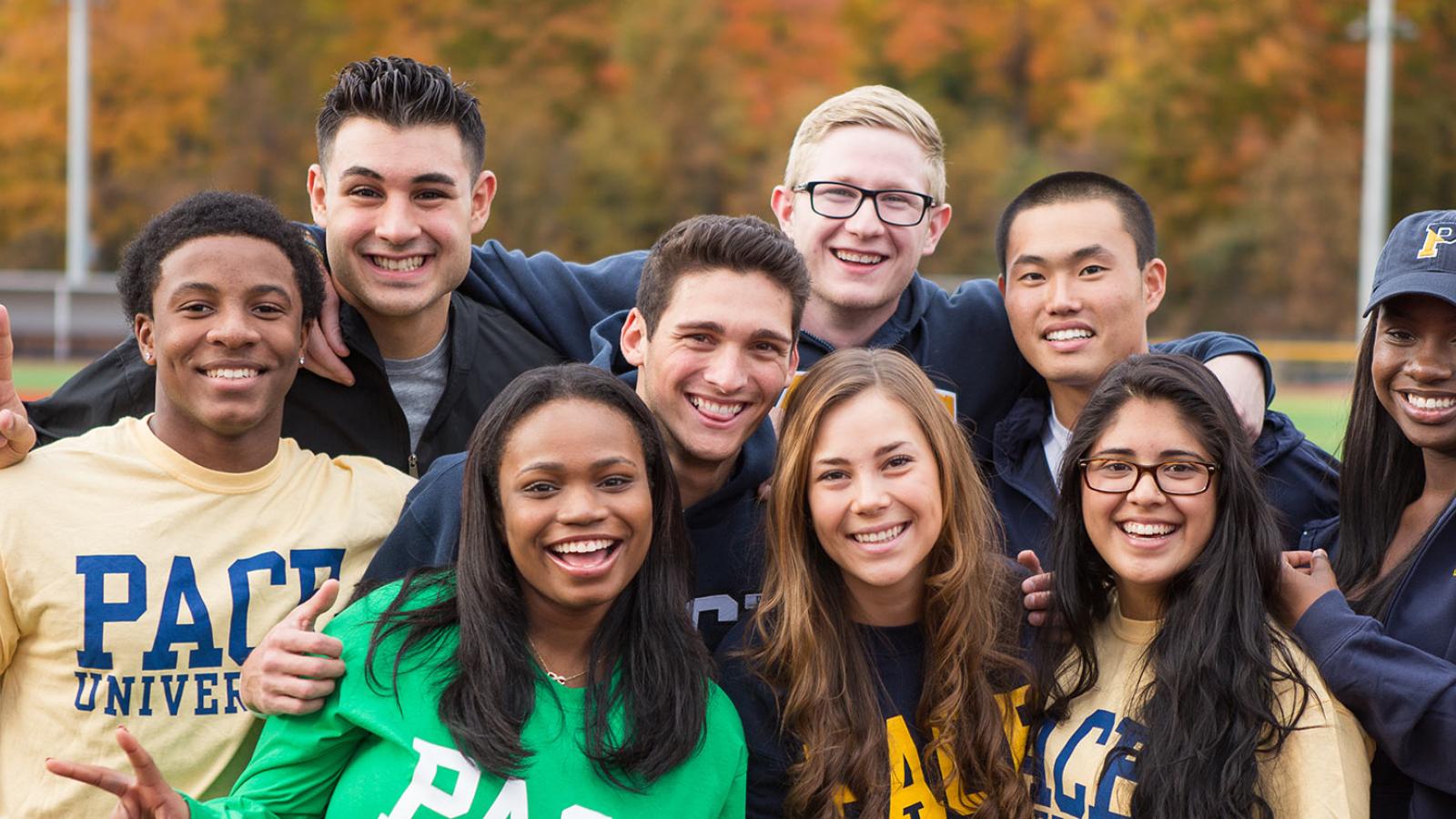 Group of Pace University students smiling at the camera.