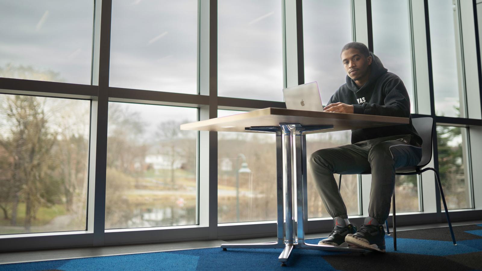 man posing for camera on pace's westchester campus.