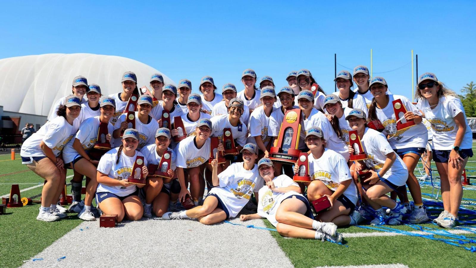 Women's lacrosse team celebrating their national championship victory