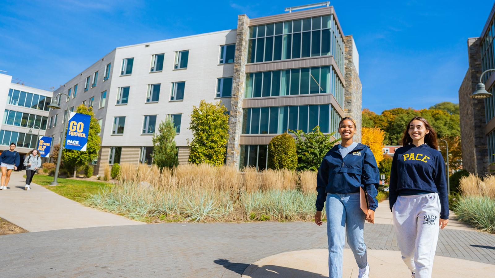 Two female students walking on the Pace University Pleasantville campus