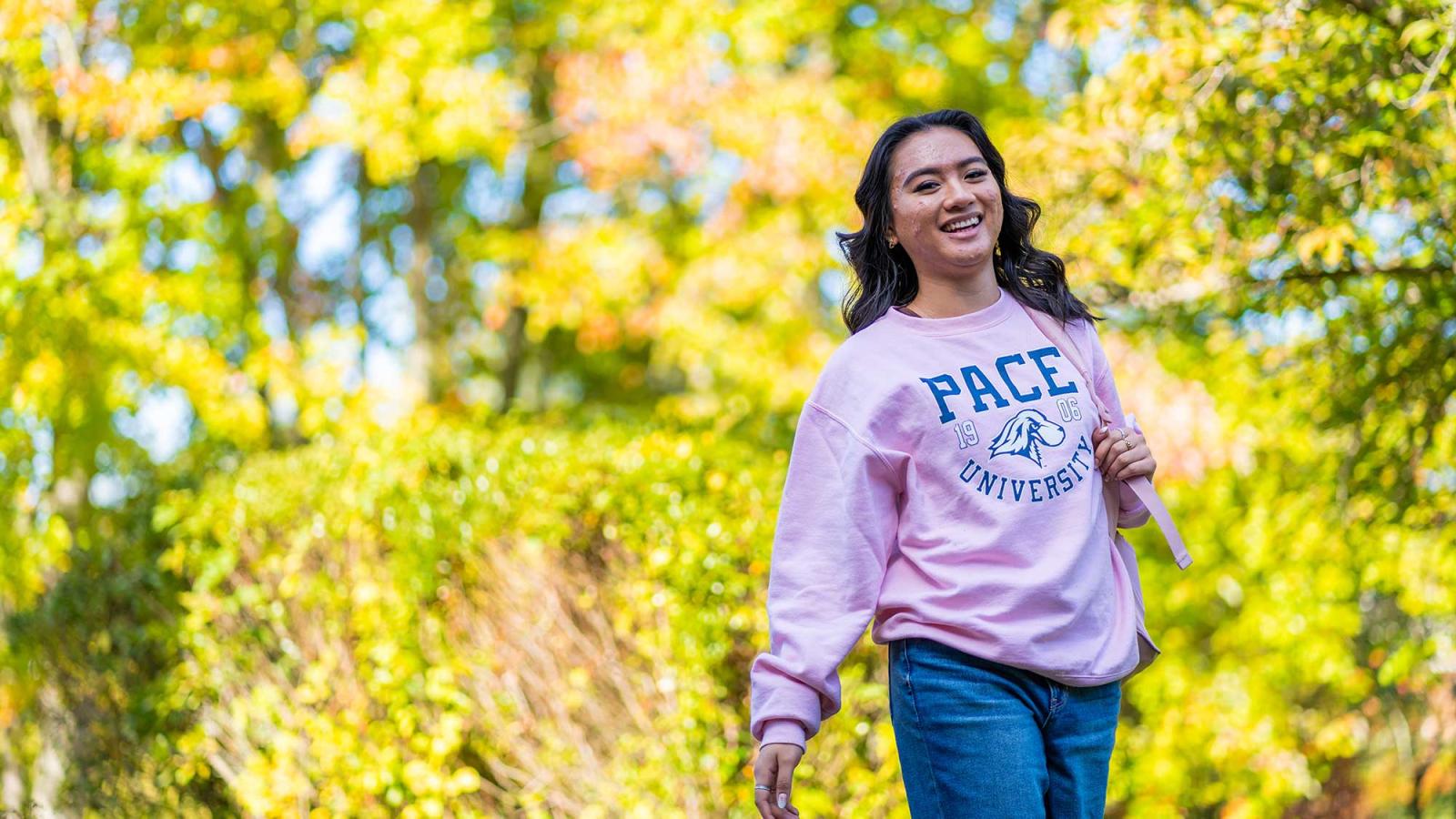 student walking on Pleasantville Campus