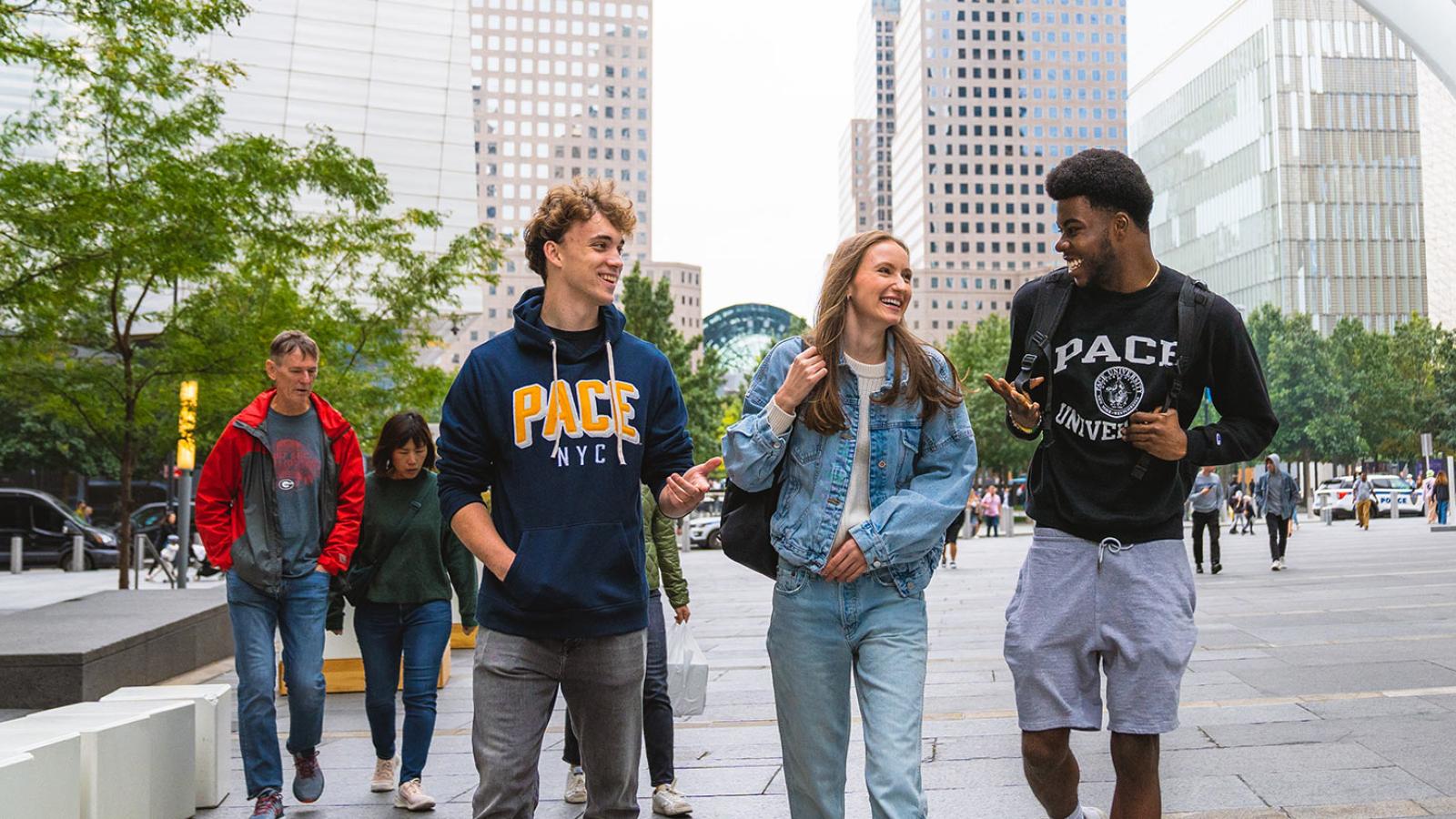 Pace University students walking on a sidewalk in lower Manhattan