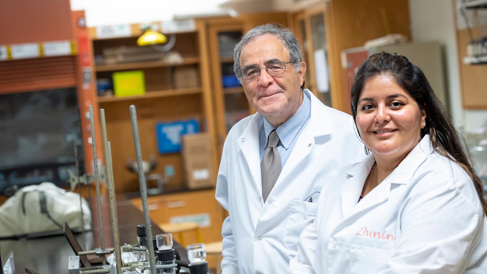 Pace University's Pleasantville Chemistry lab student smiling with professor David Nabirahni