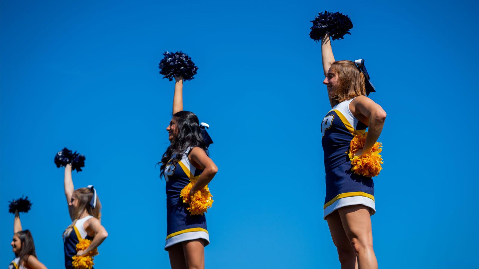 pace cheerleaders against a blue sky