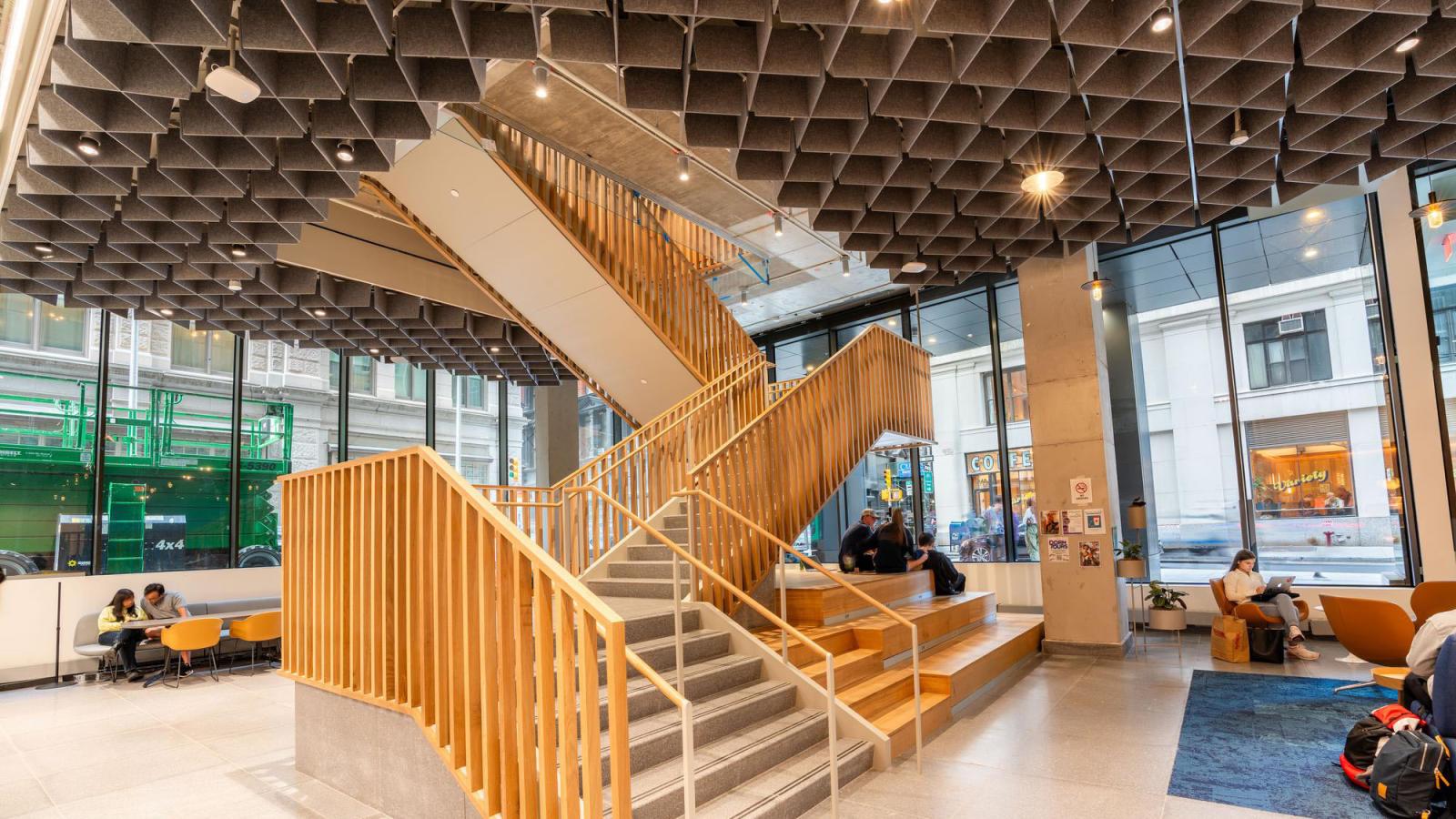 interior of Pace's 15 Beekman lobby showing a large stair case