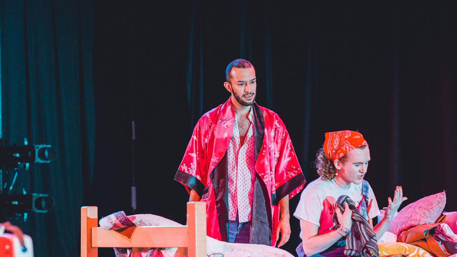 Group of Pace University students performing a play on stage.