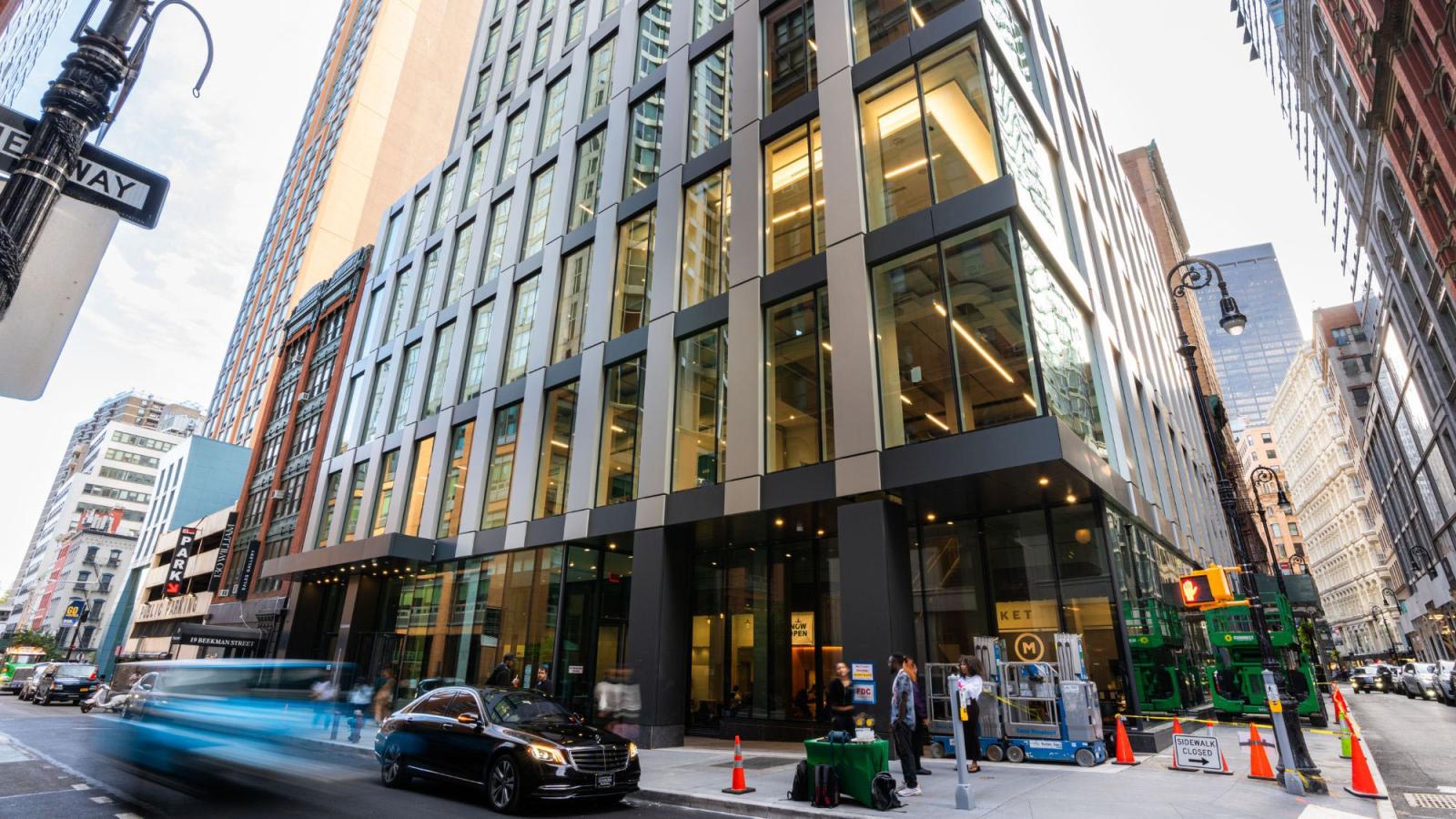 The exterior facade of the 15 Beekman building, a busy intersection in downtown NYC