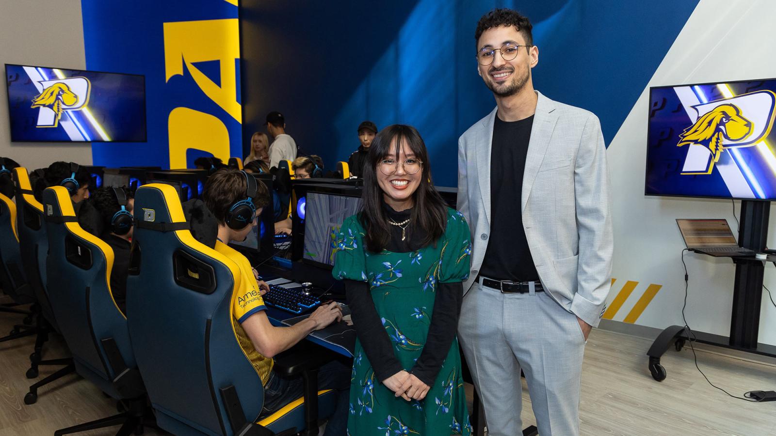 Pace University student, Julia Cardillo and Jesse Bodony stand in the NYC Esports Facility 