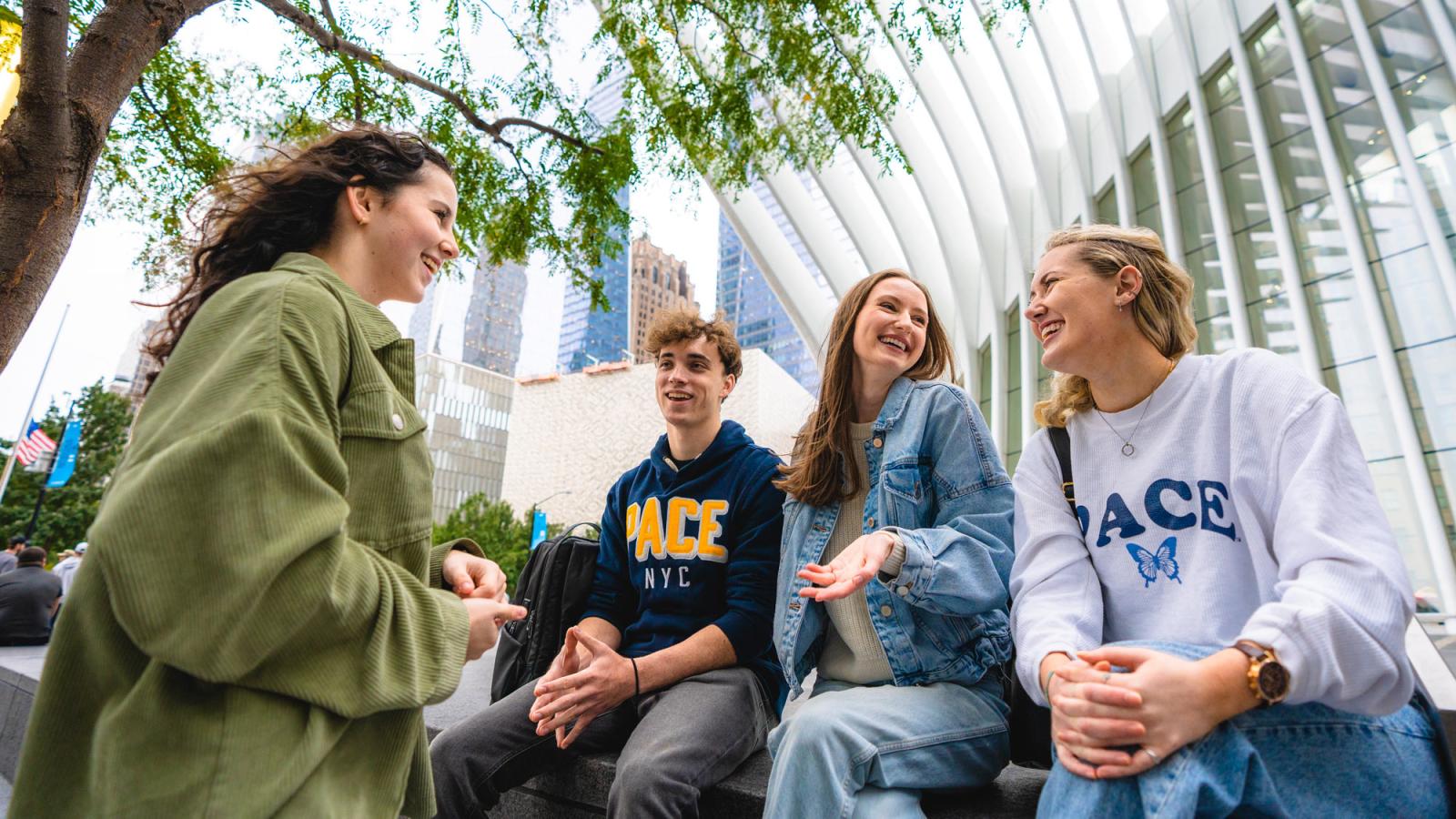 group of pace university students hanging out near the oculus. 