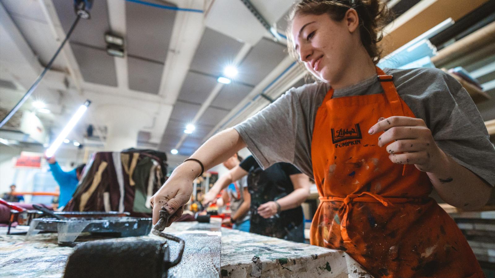 Sands College of Performing Arts student painting scenery