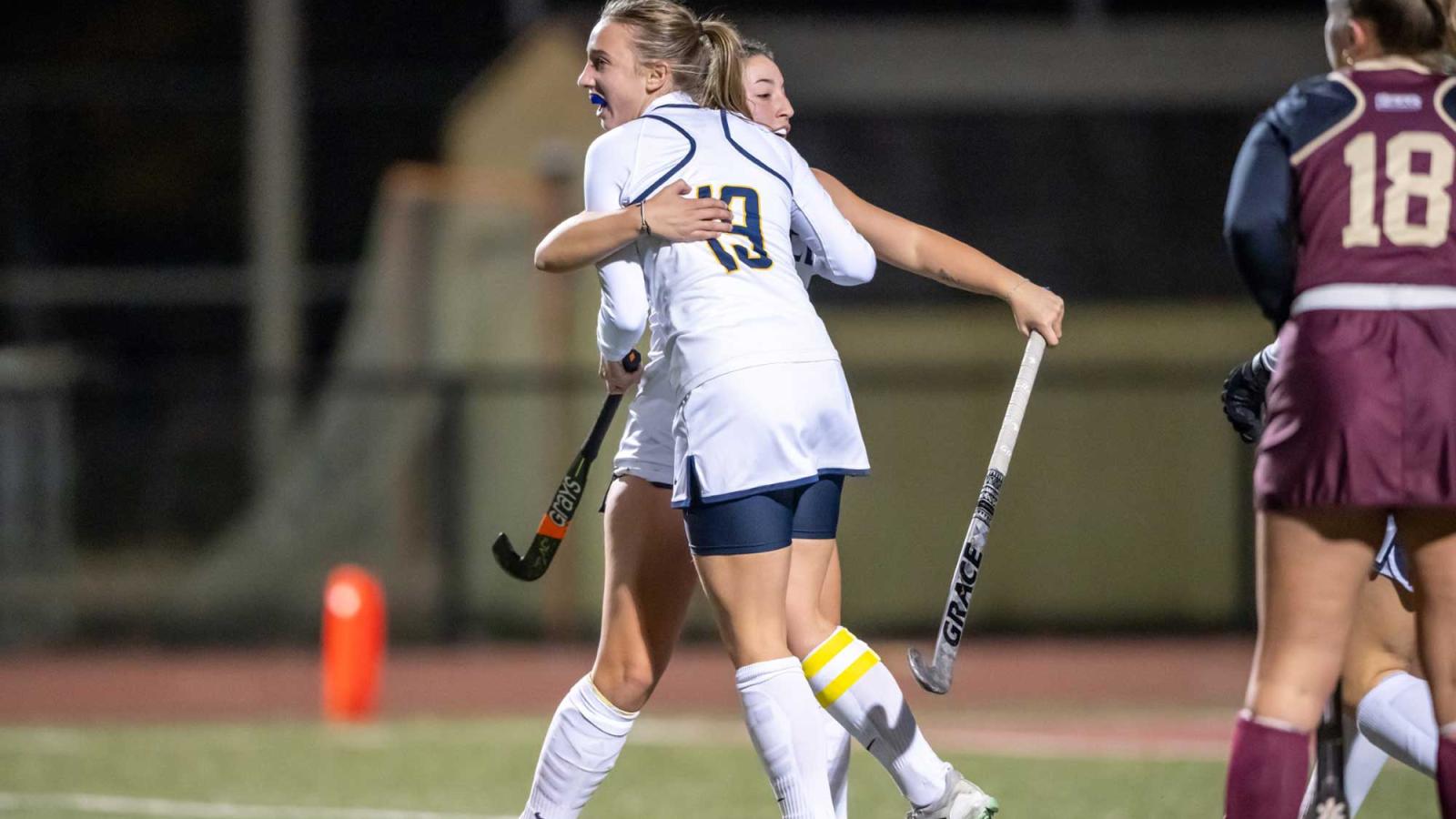 Field Hockey players Noelle Meij and Krista Dietz celebrating a goal