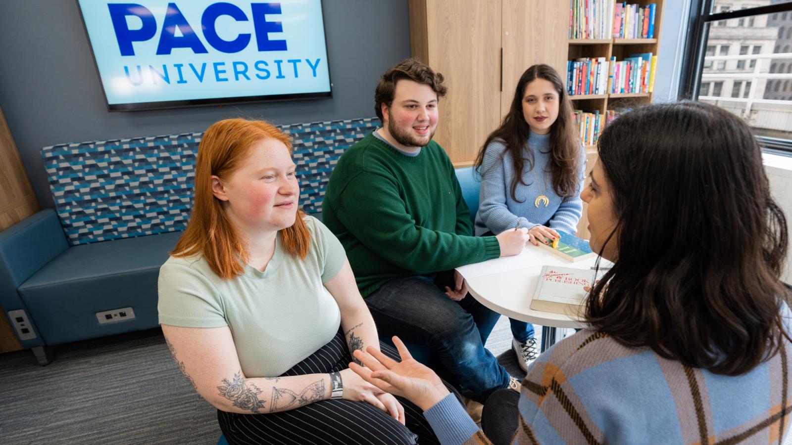 Group of Pace students speaking with their advisor. 