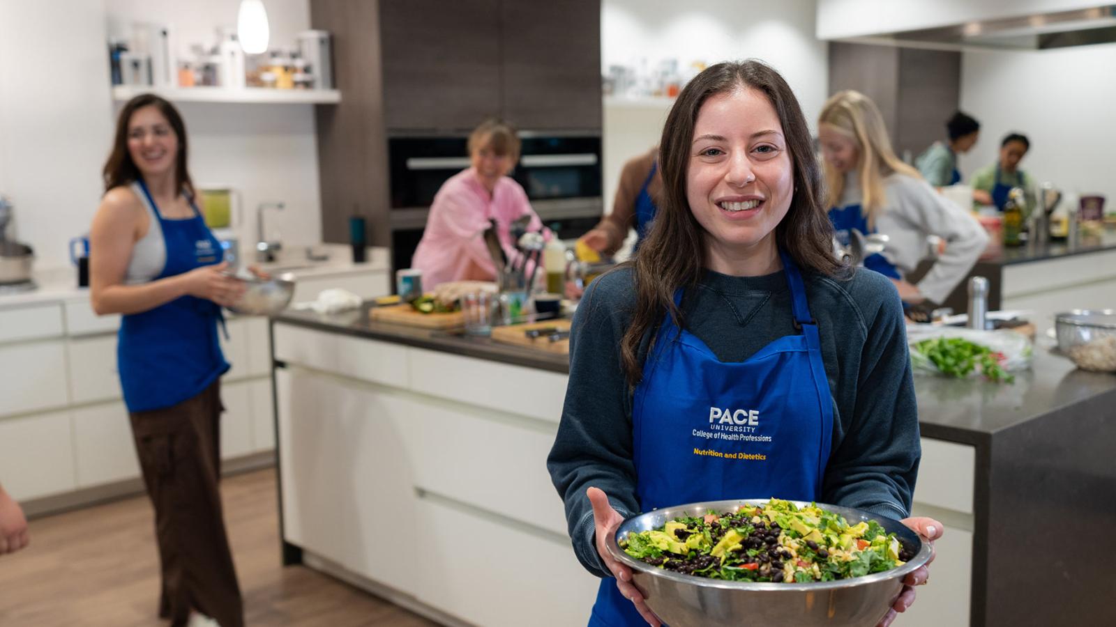 Student cooking in the Teaching Kitchen