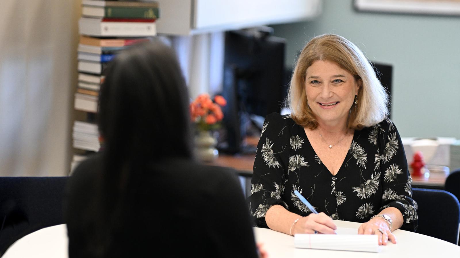 Elisabeth Haub School of Law faculty member Jill Gross, meeting with a student