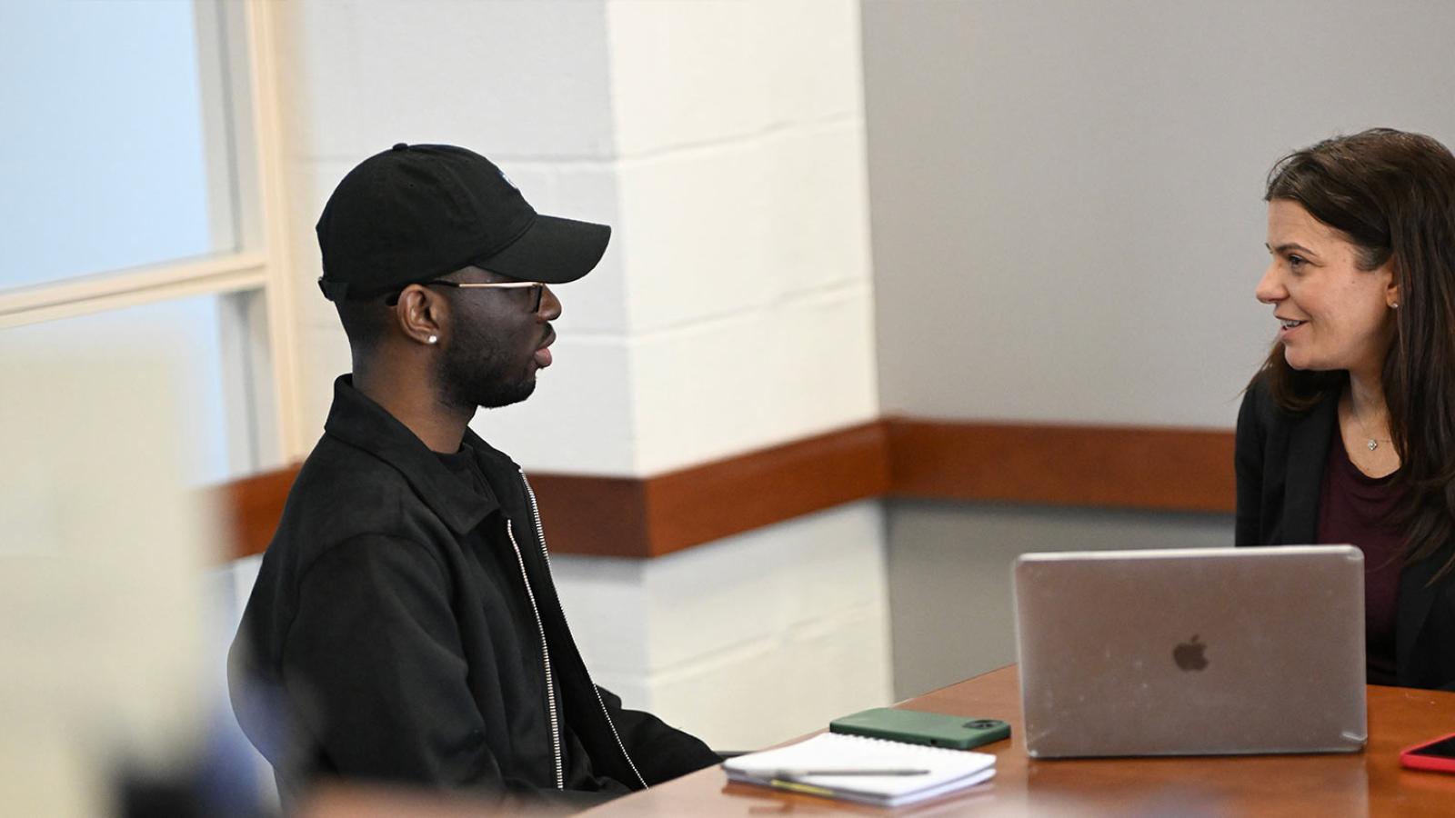 Lawyer and client talking during pro bono work