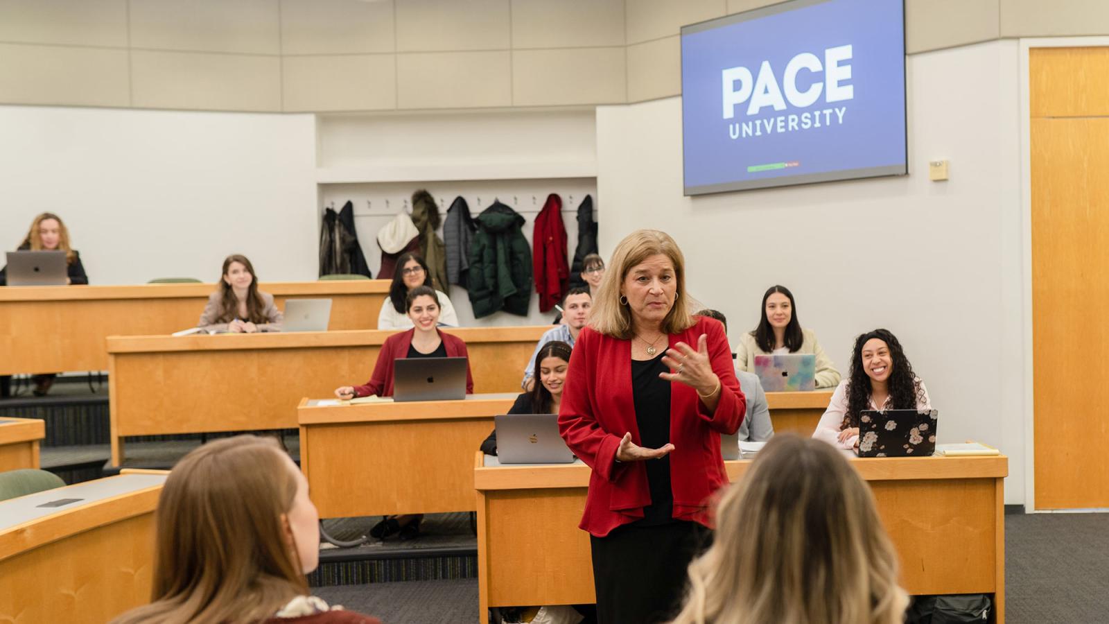 Jill Gross, professor at the Elisabeth Haub School of Law, speaking to a classroom of students.