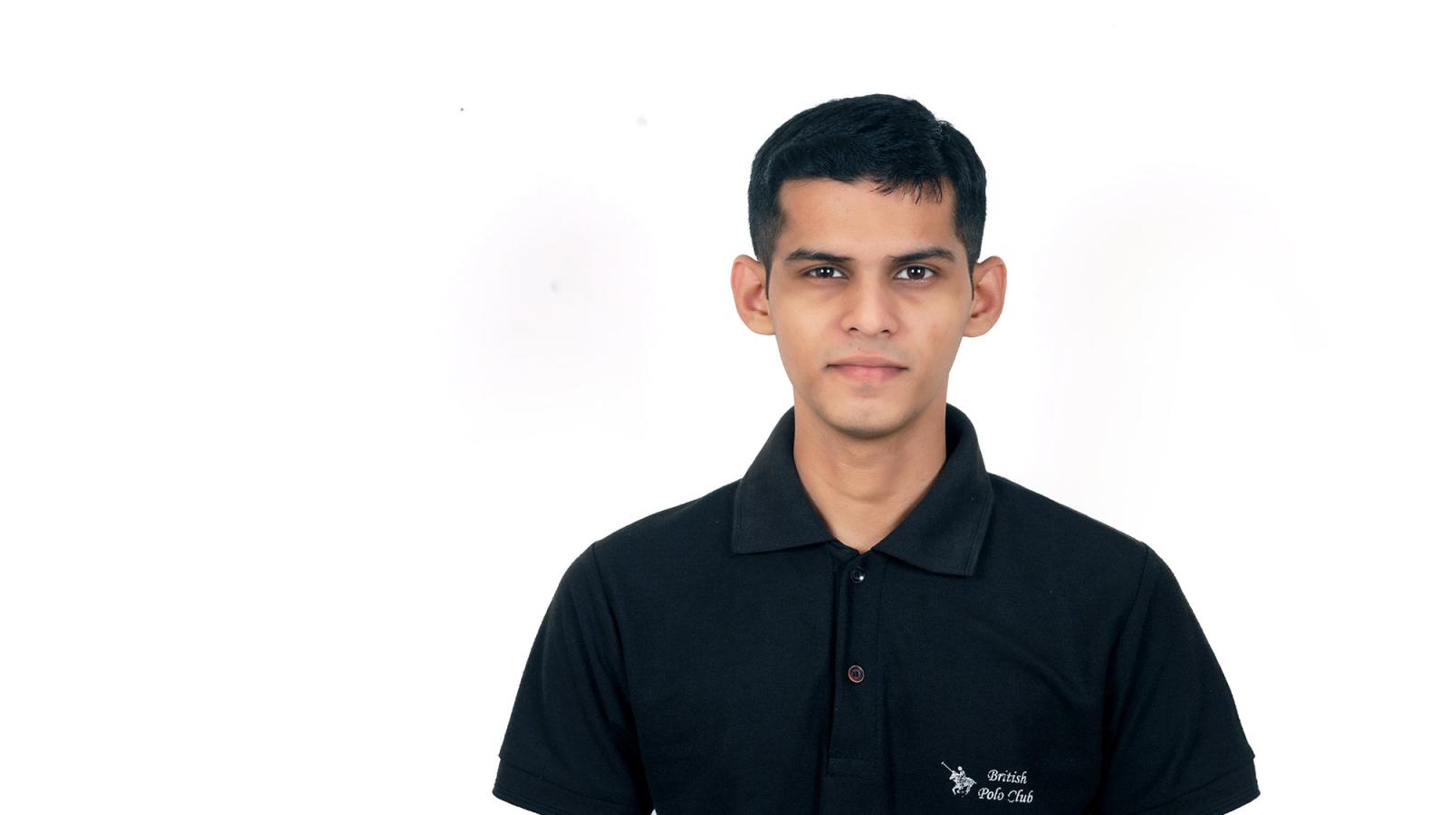Pace student Ross Carvalho in front of a white background