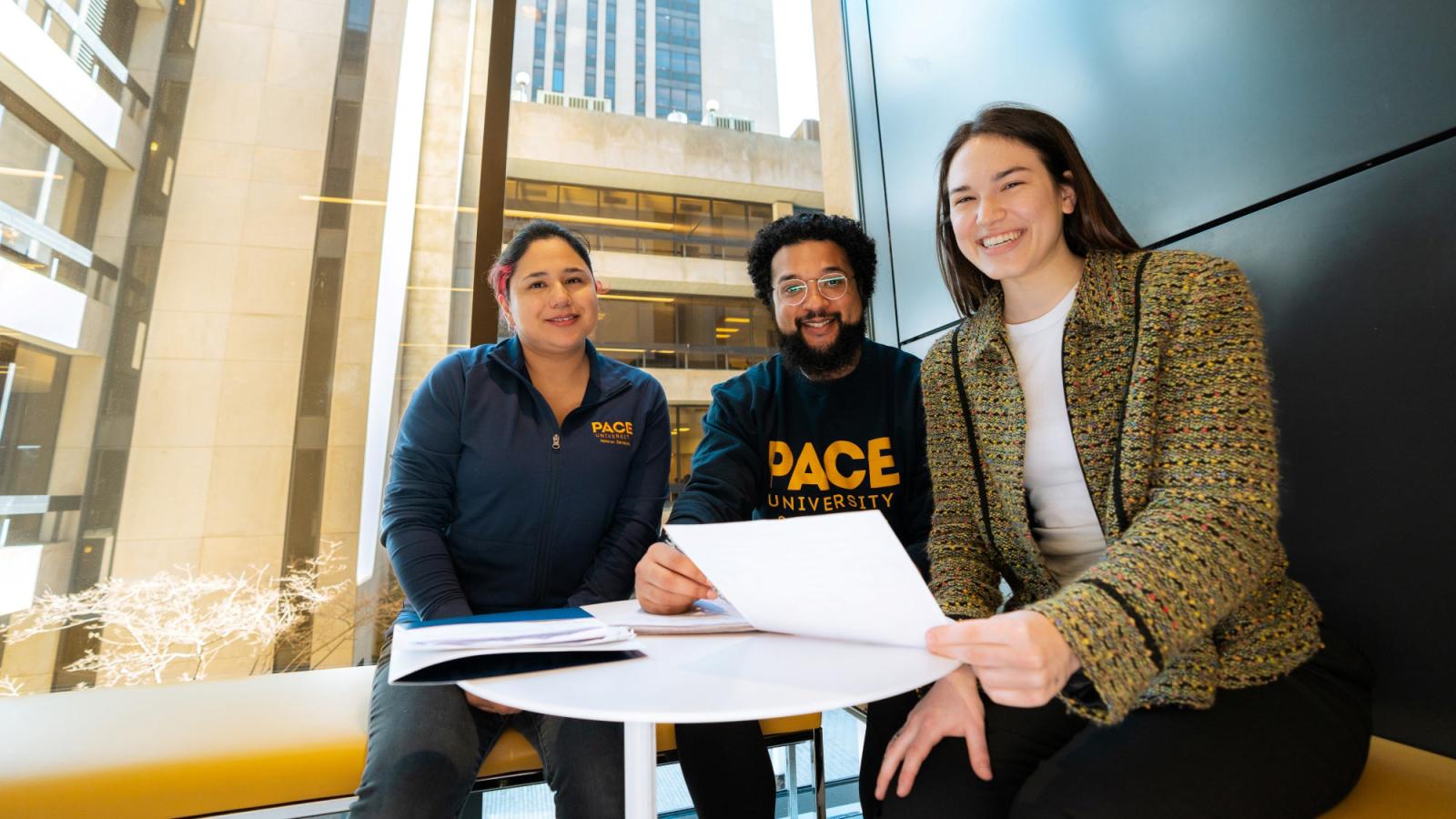 Three pace university students on the NYC campus