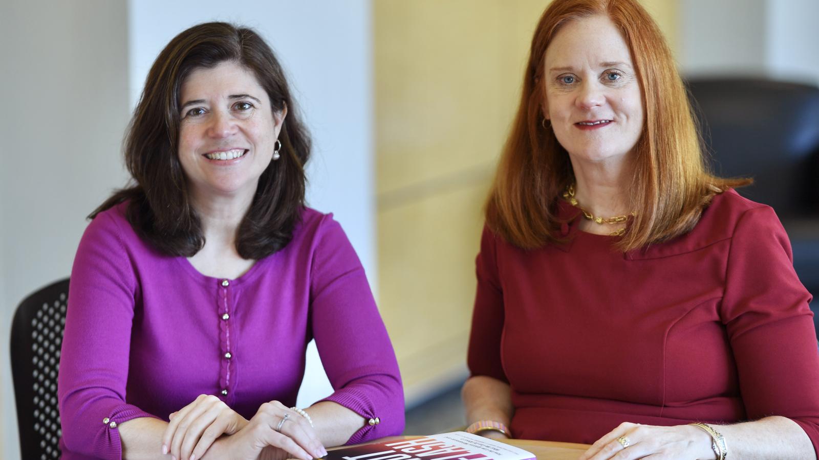 Elisabeth Haub School of Law Professors Emily Gold Waldman and Professor Bridget J. Crawford with their book, Hot Flash.