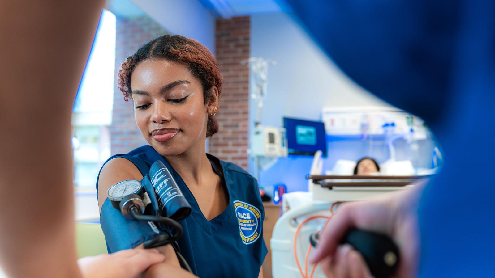 Pace University College of Health Professions nursing student in the simulation lab