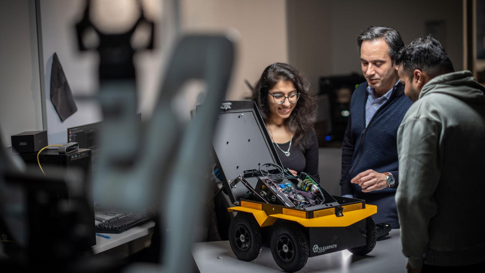 Seidenberg students and faculty in the robotics lab on Pace's NYC Campus.