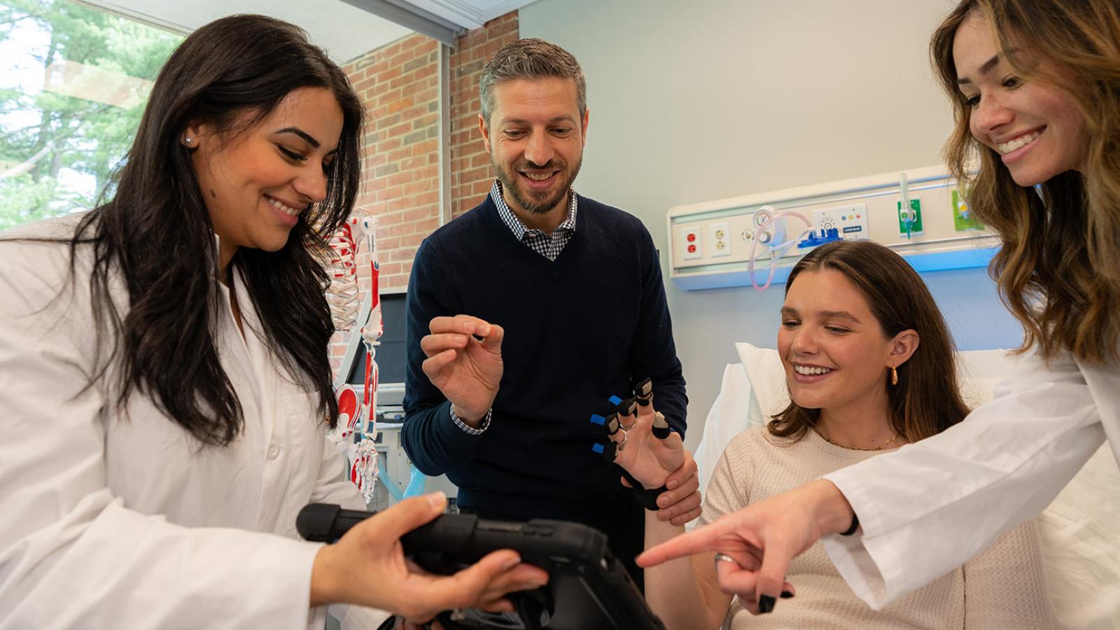 Pace University students and faculty working in the occupational therapy lab