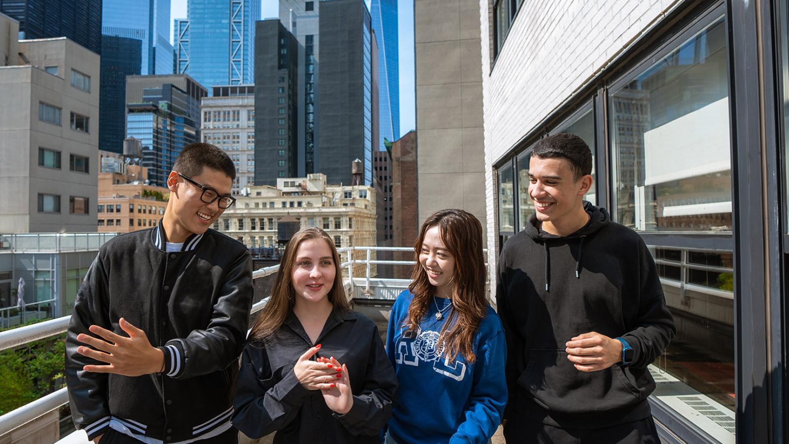 Pace Students talking at the balcony of One Pace Plaza