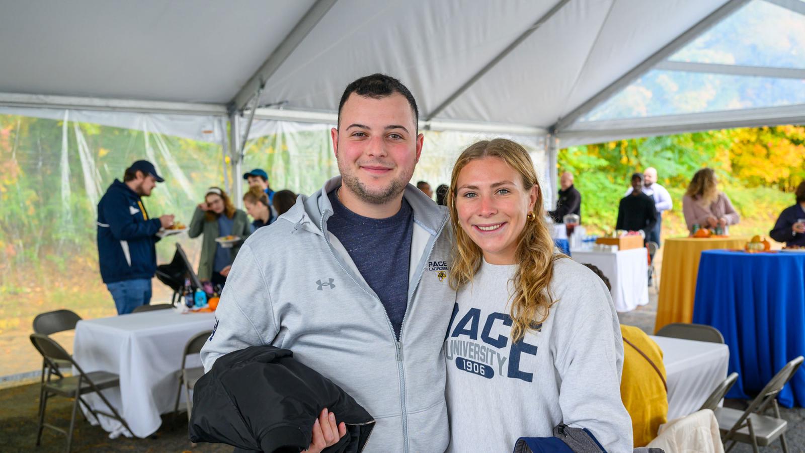 Two Pace Unievrsity alumni attending Homecoming on the Westchester campus.
