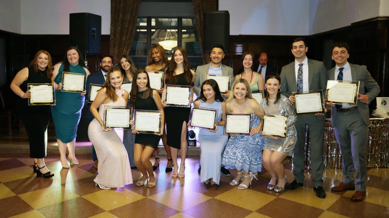 Elisabeth Haub School of Law at Pace University Students Holding up Awards atAdvocacy Affair