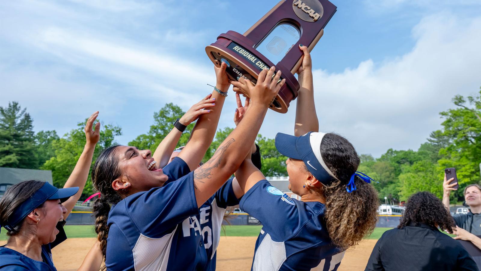 Softball champions holding a trophy.