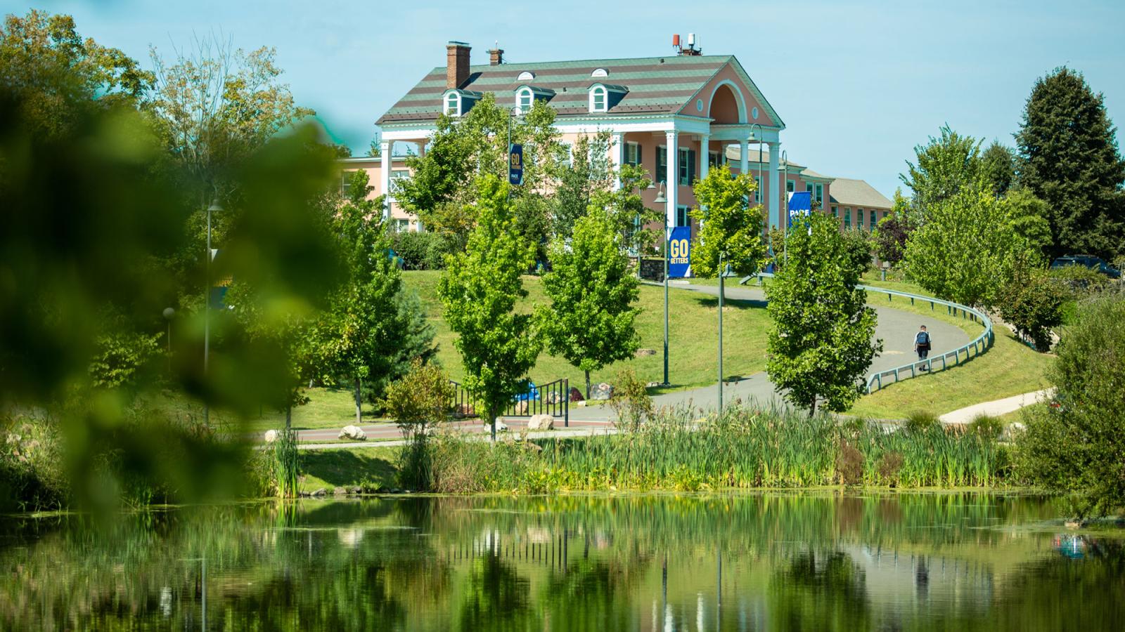 Pleasantville's Choate House sitting atop a hill overlooking Choate Pond.