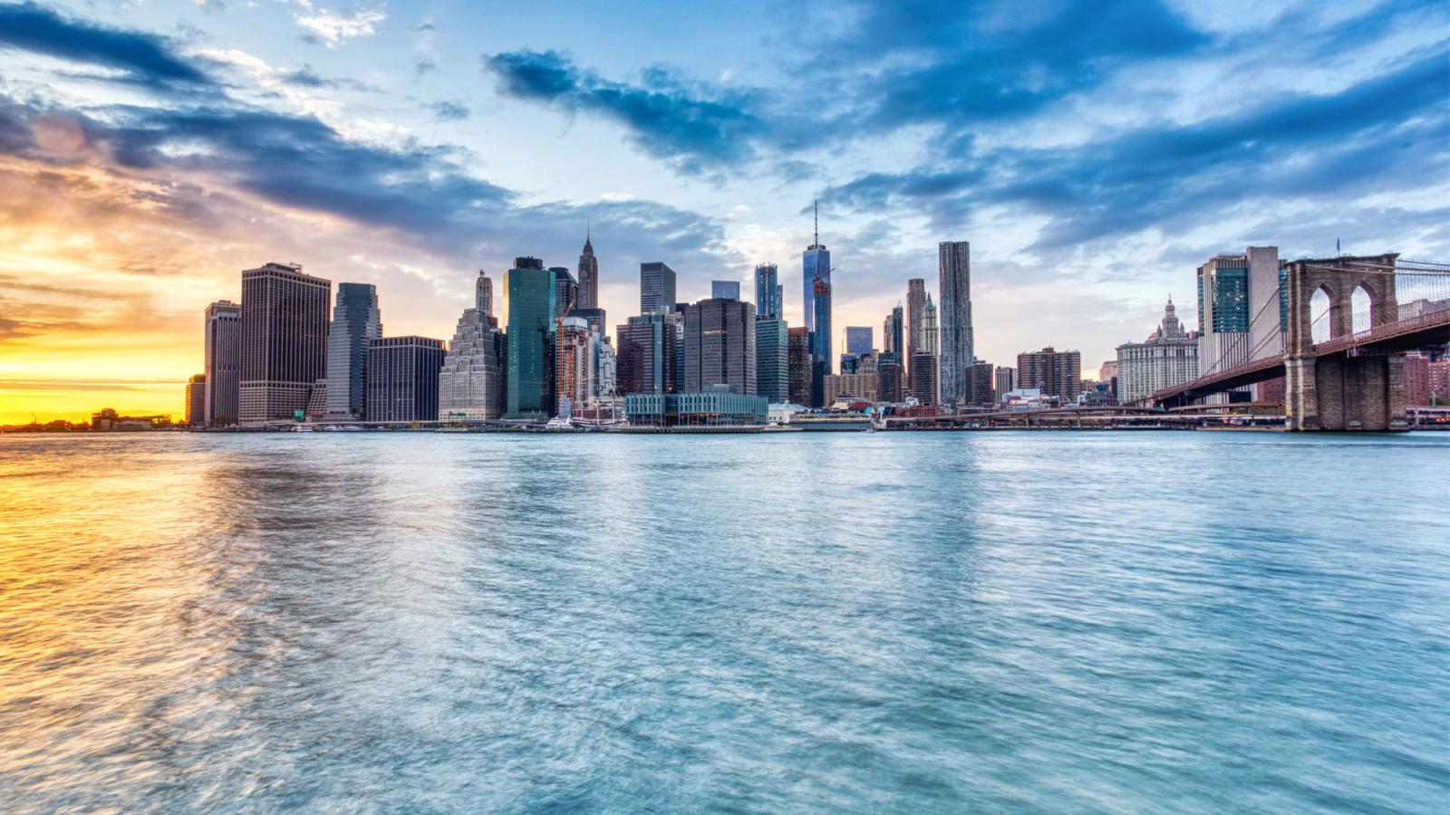 Waterfront view of downtown Manhattan at sunset.