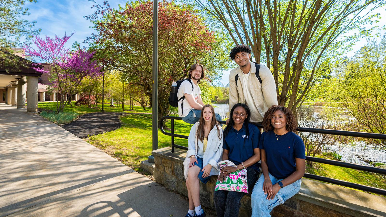 Pace students smiling for the camera on the Pleasantville campus