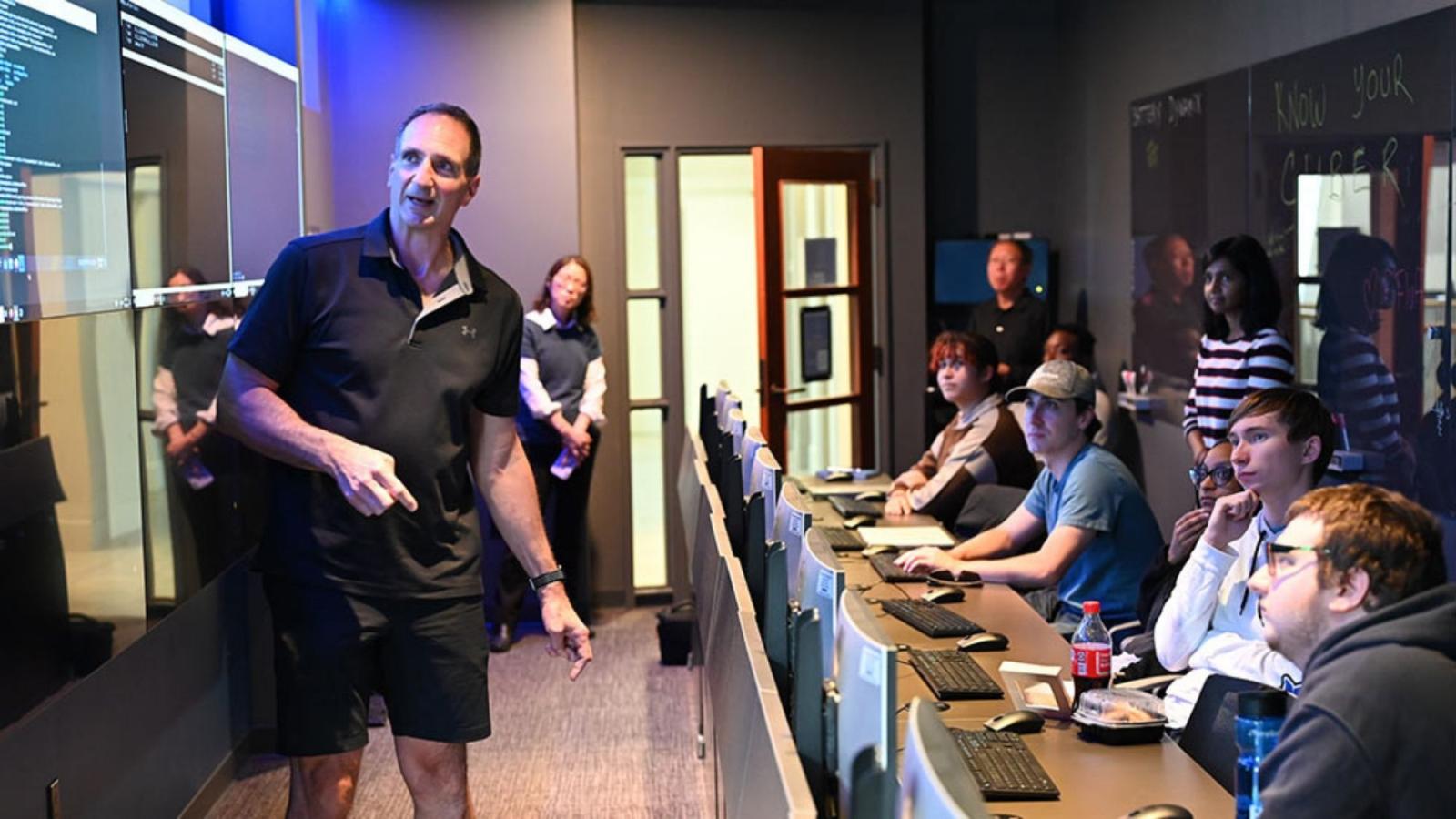 Seidenberg professor Joe Acampora teaching students in the Pace Cyber Range.