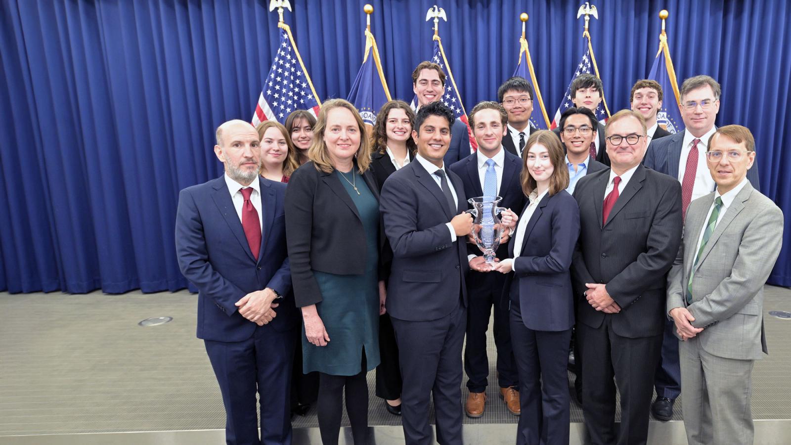 Pace University Federal Reserve Challenge Team winners standing together holding trophy