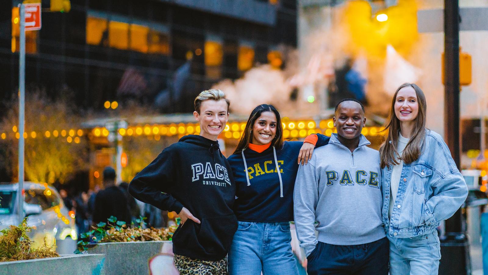 Four Pace University students stand outside in Manhattan