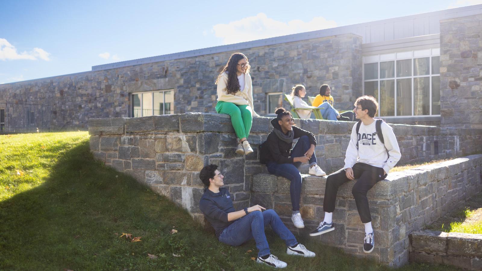 Group of students talking on Pace's Pleasantville Campus.