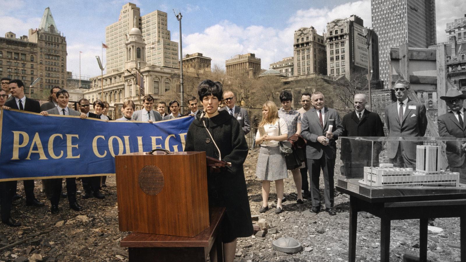 Black and white image fading to color of the groundbreaking of One Pace Plaza in 1967.