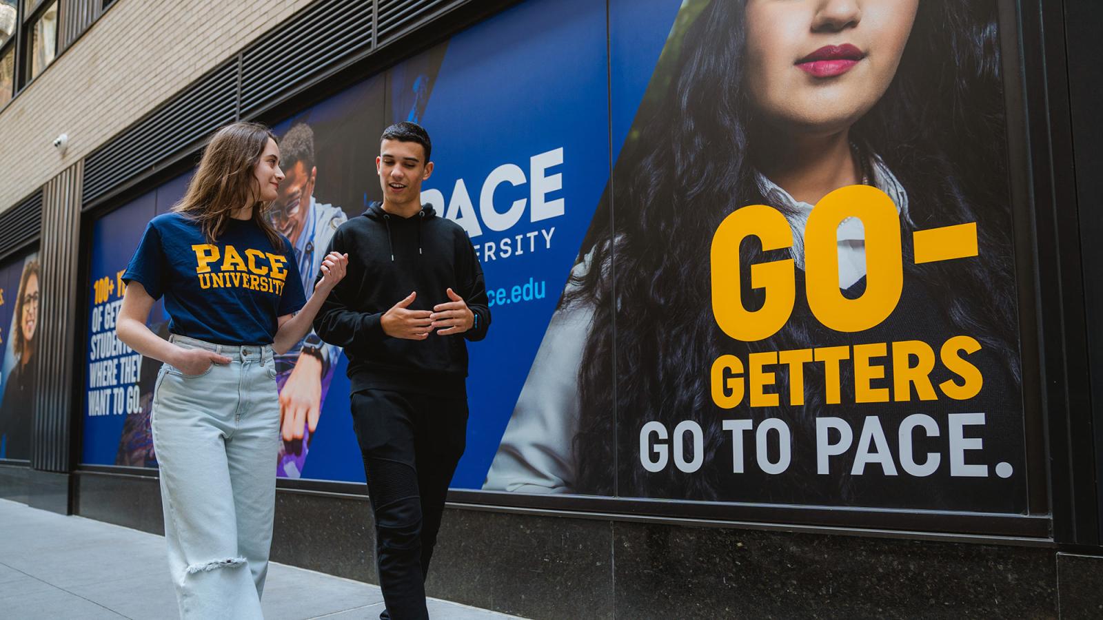 two students standing outdoors on the New York Campus of Pace University