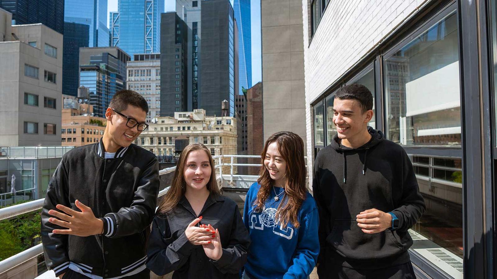 Pace Students talking at the balcony of One Pace Plaza