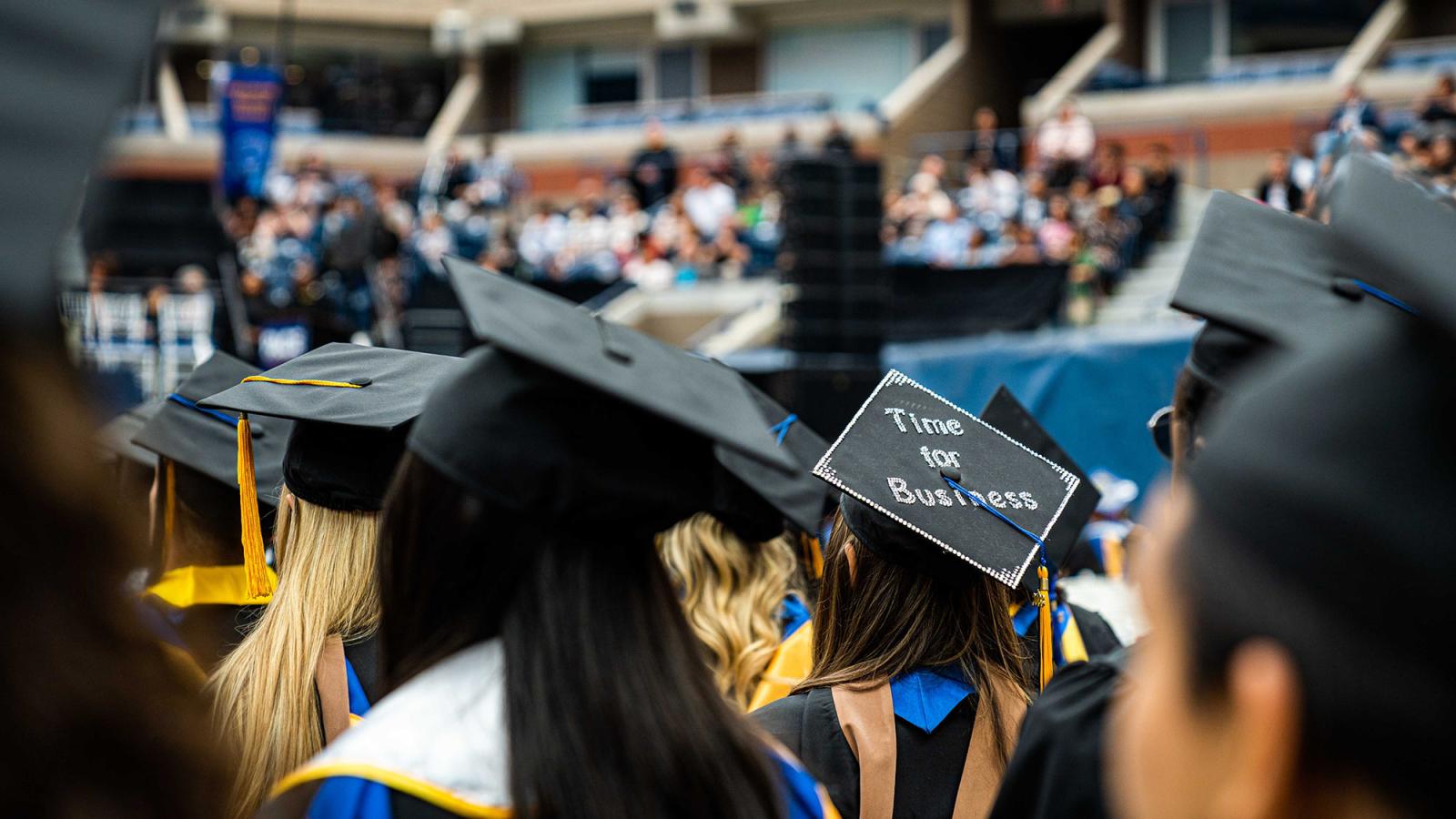 At Pace University Commencement, a grad cap reads Time for Business