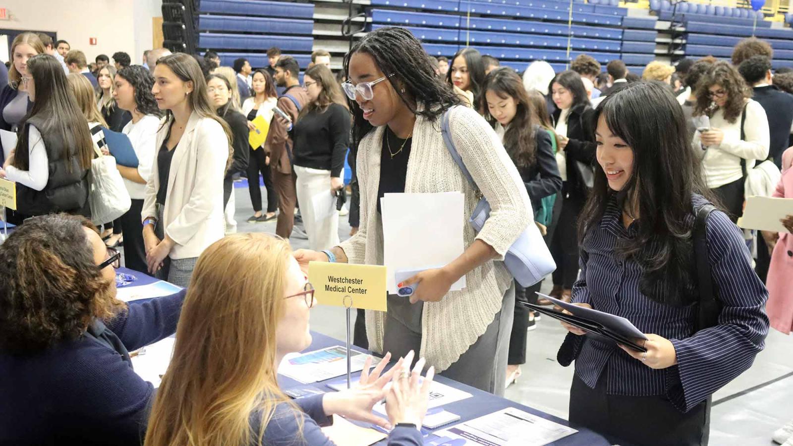 Pace University students speaking with employers at the Fall 2025 Career Fair