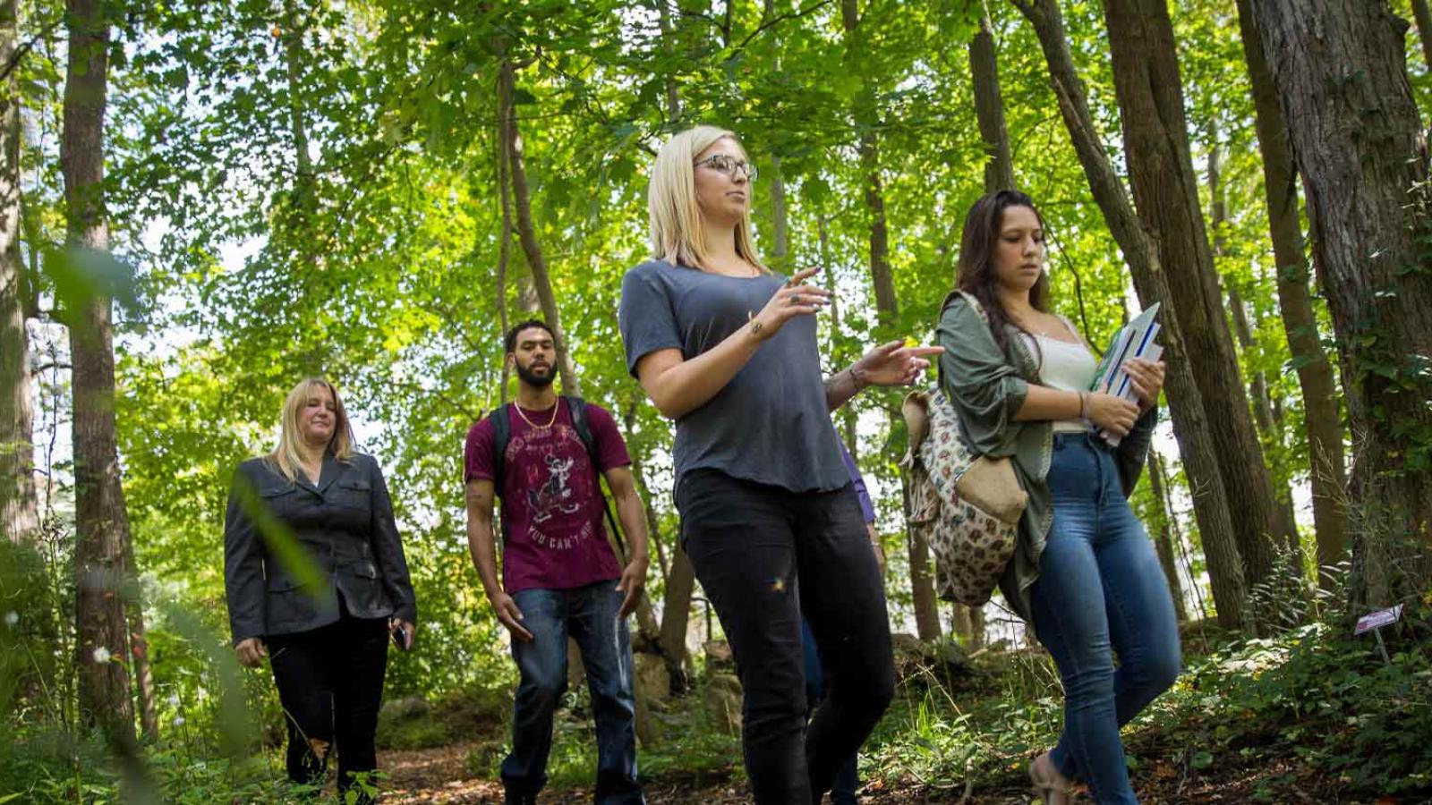 Students on a wooded trail near the Pleasantville campus
