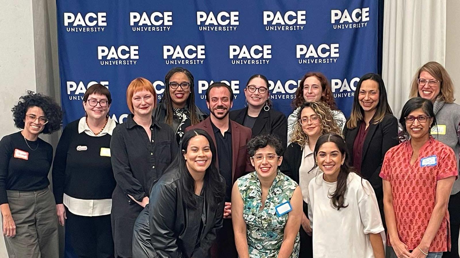 Group of Pace University's Women's and Gender Studies faculty, students, and alumni standing together