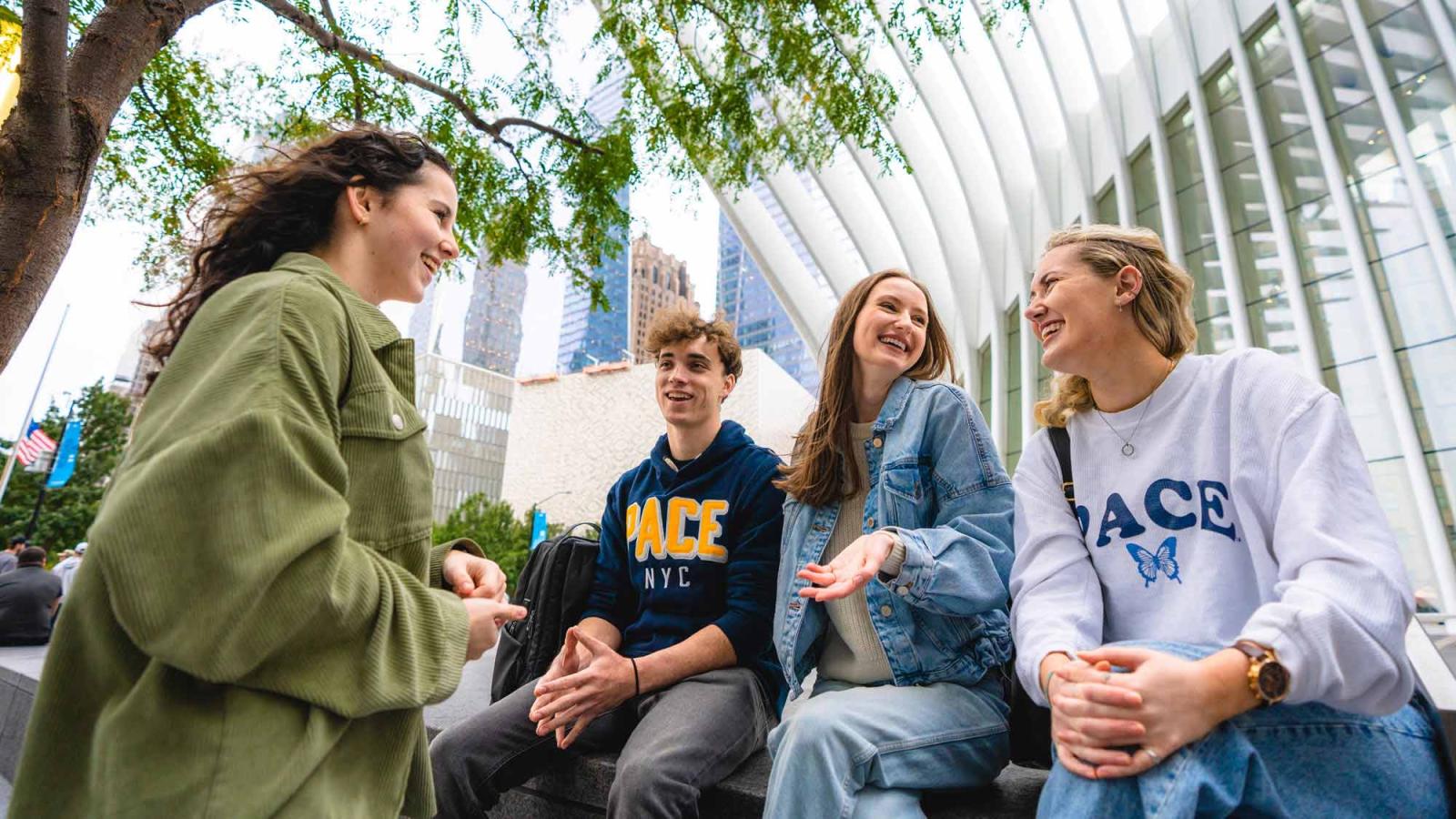 group of pace university students hanging out near the oculus.