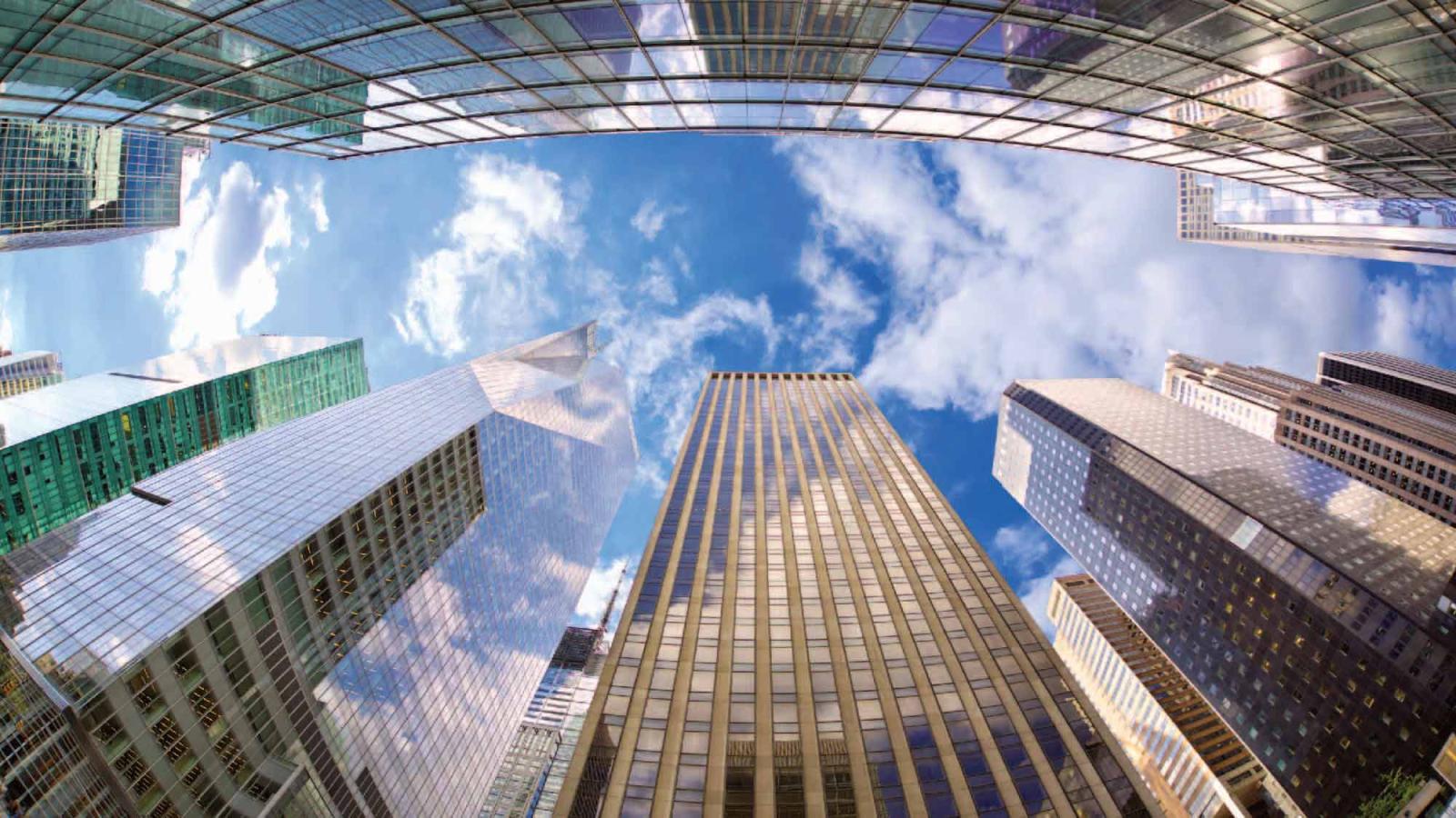 Manhattan skyscrapers as viewed from the street below.