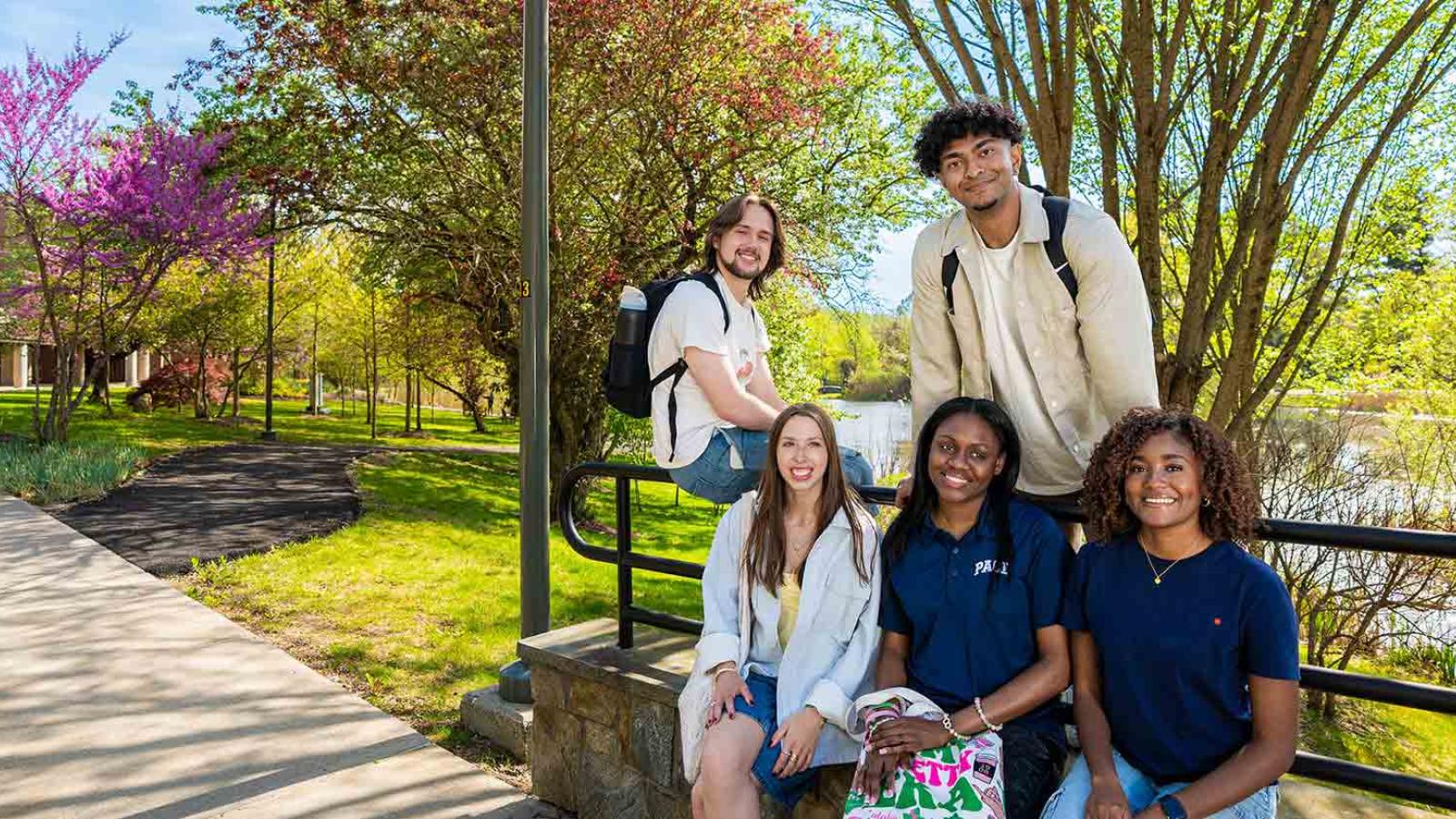 Pace students smiling for the camera on the Pleasantville campus