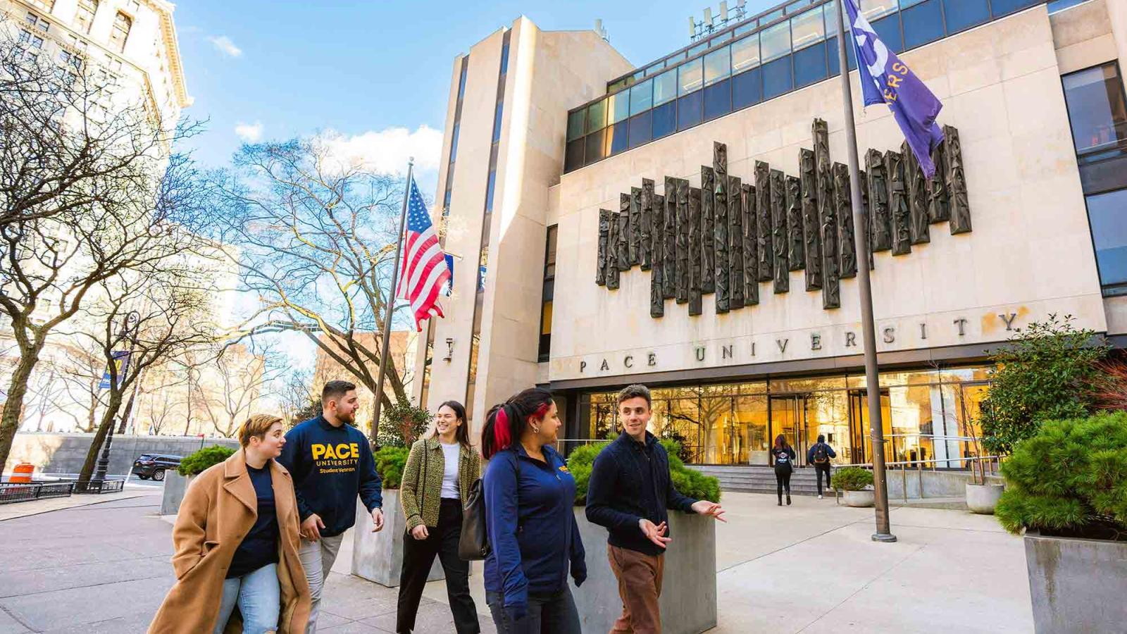 Pace University students walking in front of 1 Pace Plaza at the NYC campus.